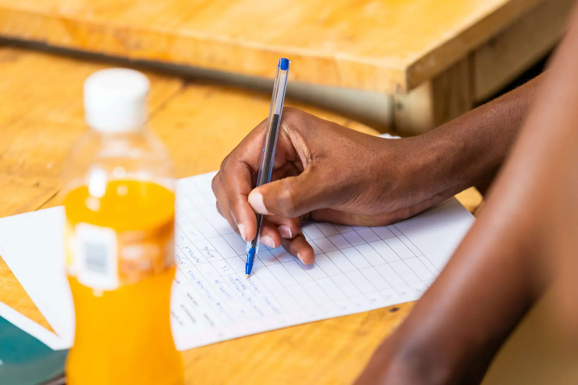 A participant taking notes during a skills training session