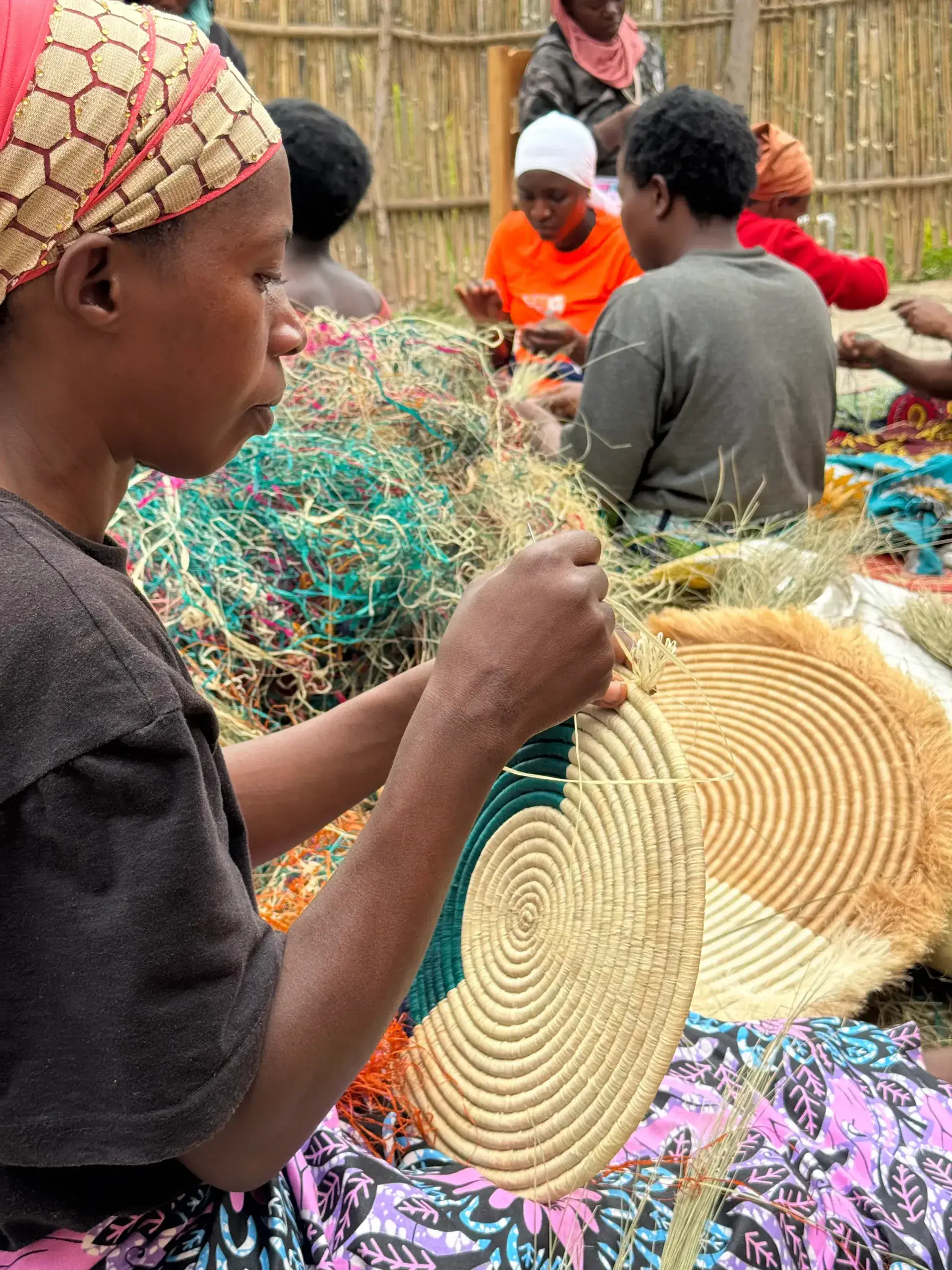 Hands holding a newly woven basket