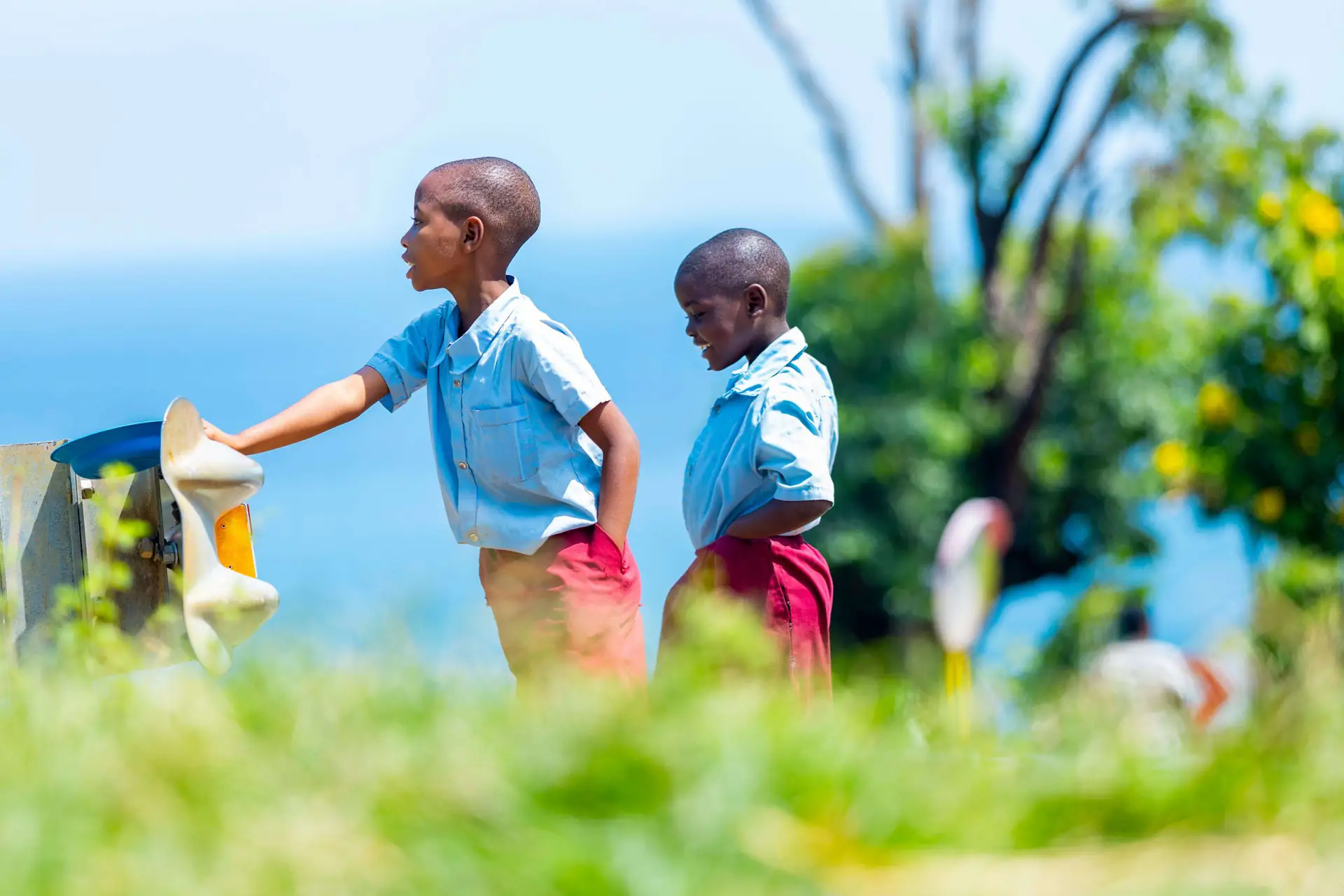 Children playing by the lake